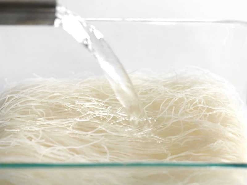 Pour boiling water on rice noodles