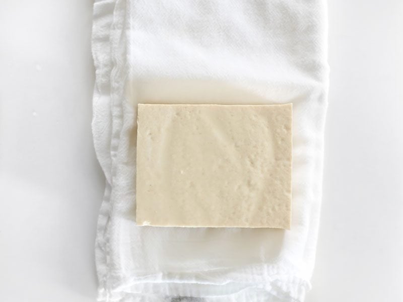Wrap Tofu in a cloth to press moisture out
