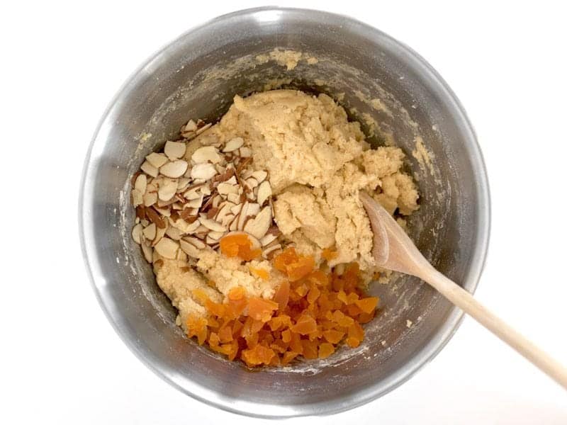 Add Almonds and Apricots to biscotti dough in the bowl