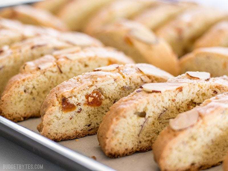 Freshly baked Almond Apricot Biscotti still on the baking sheet, viewed from the side