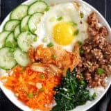 Overhead view of a bibimbap bowl meal.