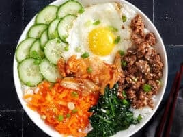 Overhead view of a bibimbap bowl meal.