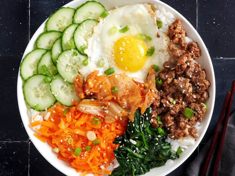 Overhead view of a bibimbap bowl meal.