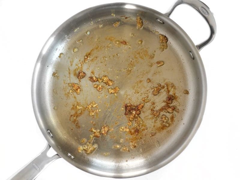 Soften Garlic in skillet with browned bits of chicken