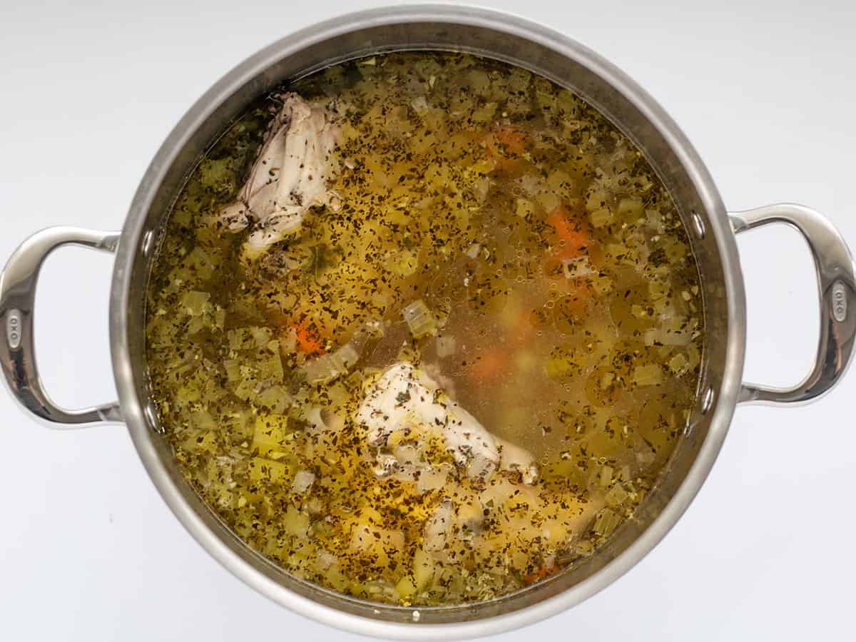 Simmered chicken soup in the pot.