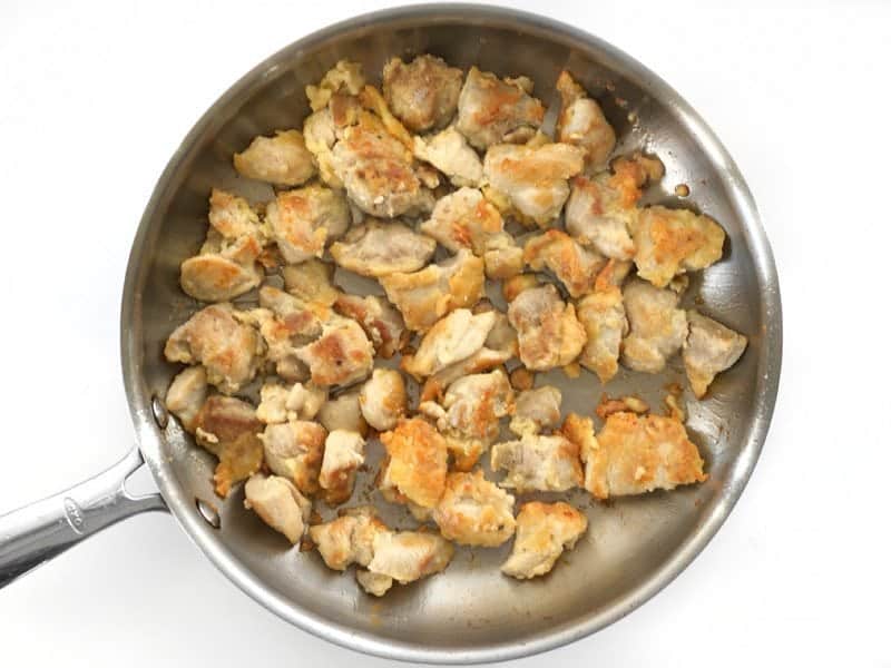 Browned Chicken Pieces in the skillet