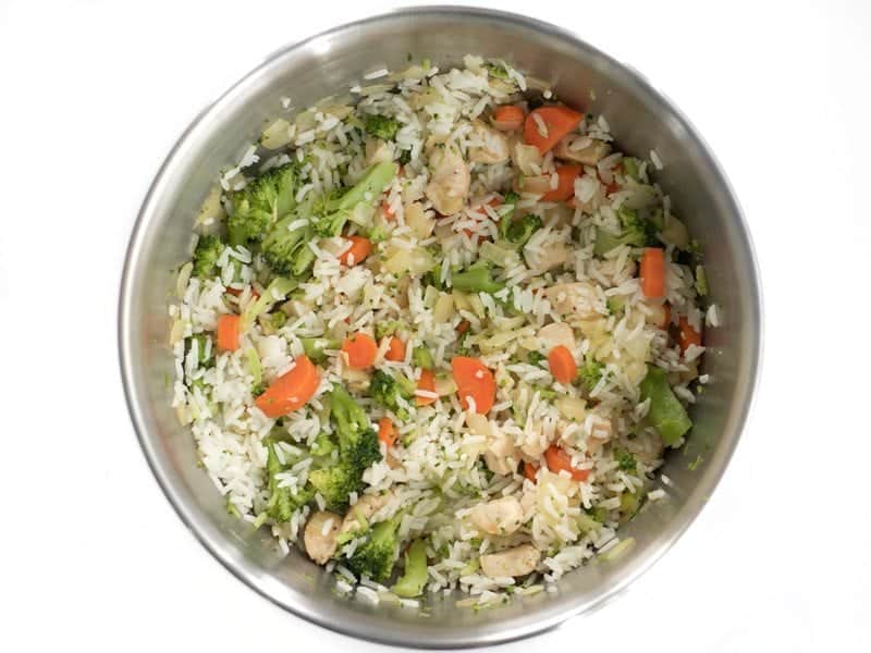 Combine Chicken Rice Broccoli Carrots and Onions in a bowl