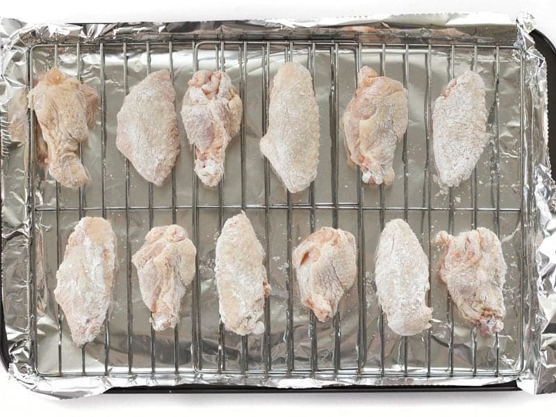 Chicken Wings on a wire rack set on a baking sheet, Ready to Bake