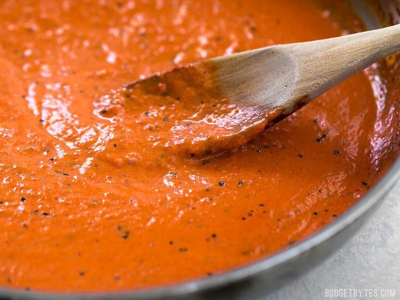 Close up of Creamy Roasted Red Pepper Sauce in the skillet from the side