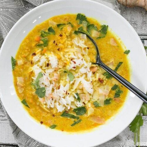 Golden Coconut Lentil Soup is a light and fresh bowl with vibrant turmeric and a handful of fun toppings. BudgetBytes.com