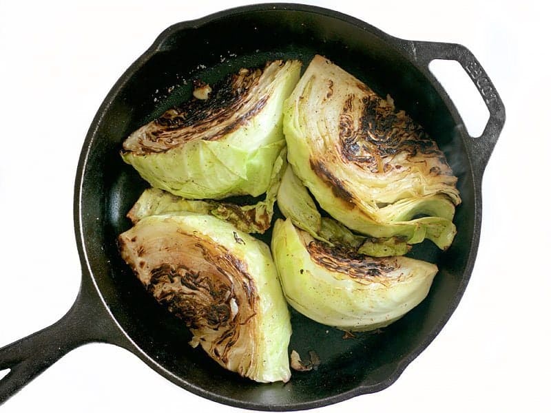 Blacked Cabbage Wedges in a cast iron skillet