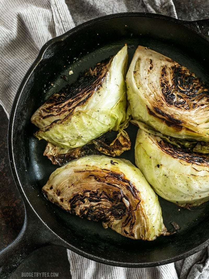 Blackened Cabbage wedges in a cast iron skillet