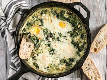 Make these fast and easy Creamed Spinach Baked Eggs using items you probably have in your pantry. A little feta on top takes it to the next level! BudgetBytes.com