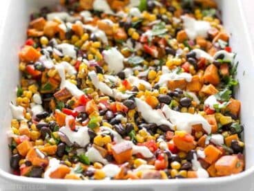 This Roasted Sweet Potato Rainbow Salad combines a medley of vibrant colors and flavors, brought together by a bright and creamy dressing. BudgetBytes.com