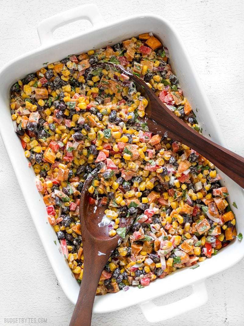 This Roasted Sweet Potato Rainbow Salad combines a medley of vibrant colors and flavors, brought together by a bright and creamy dressing. BudgetBytes.com