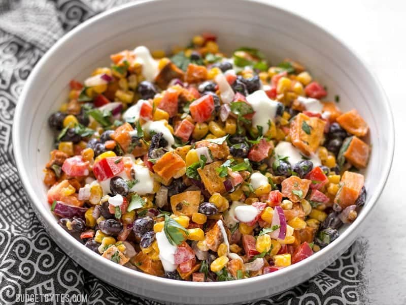 This Roasted Sweet Potato Rainbow Salad combines a medley of vibrant colors and flavors, brought together by a bright and creamy dressing. BudgetBytes.com