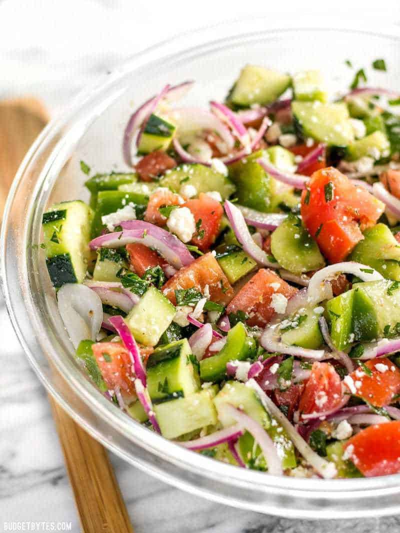 Side view of Super Fresh Cucumber Salad in a large glass bowl