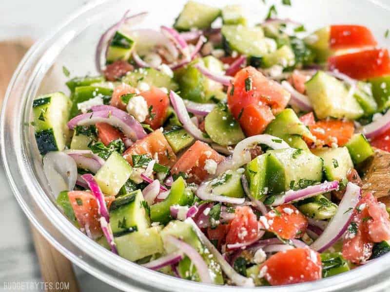 Side view of a big bowl full of Super Fresh Cucumber Salad