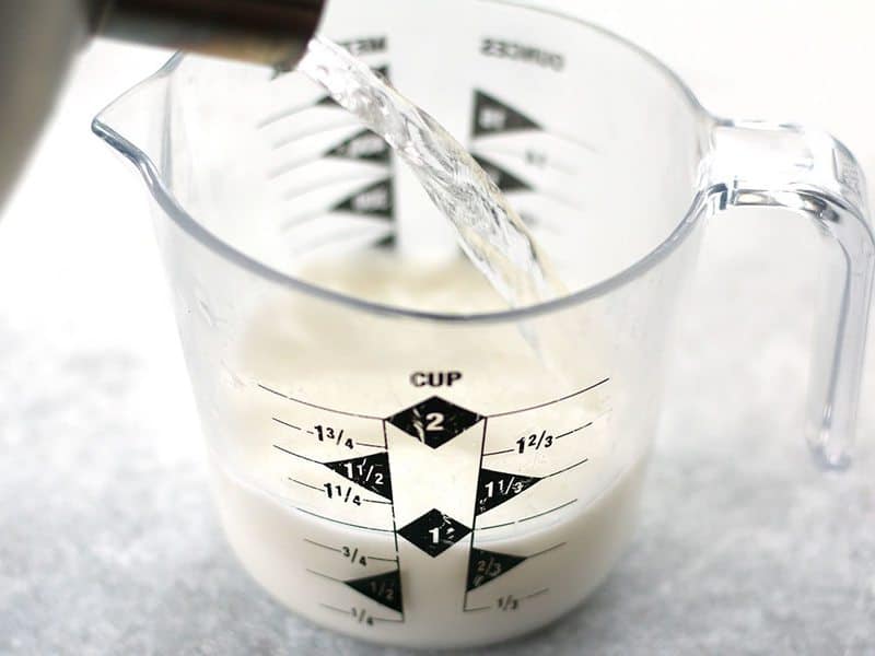 Buttermilk and Boiling Water combined in measuring cup