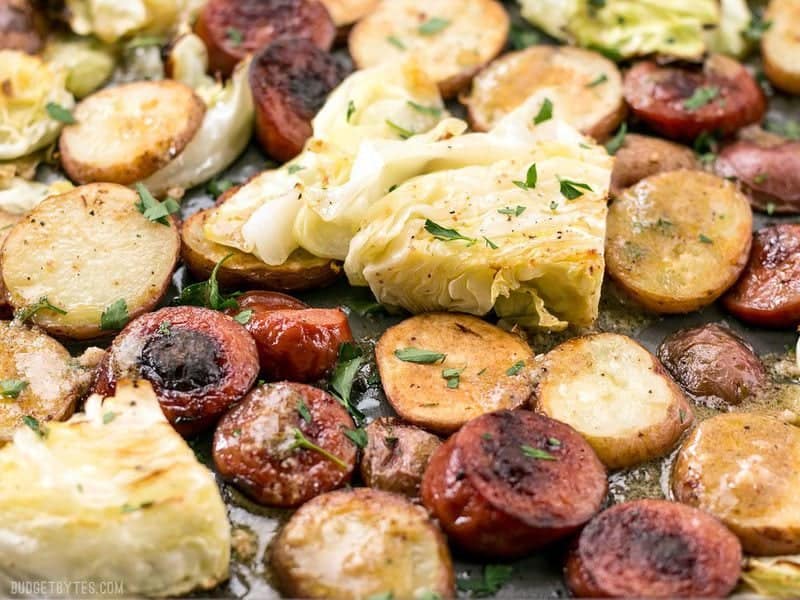Close up of Roasted Kielbasa and Cabbage Dinner on the baking sheet