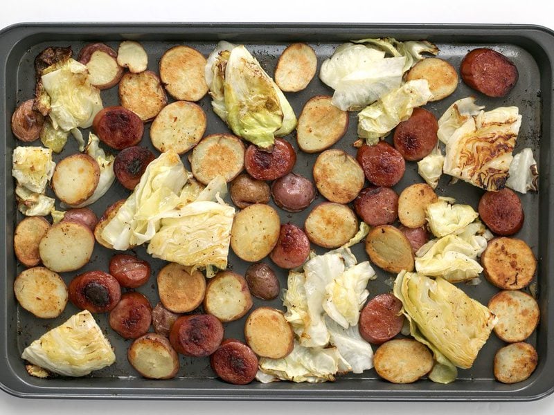 Roasted Kielbasa, potatoes, and Cabbage on the baking sheet