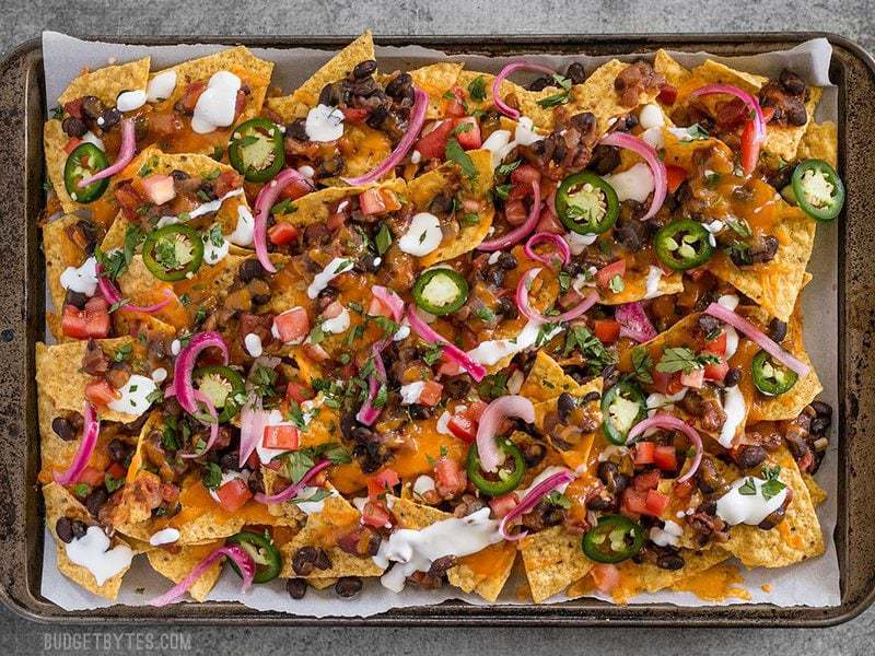 Finished Spicy Baked Black Bean Nachos still on the baking sheet