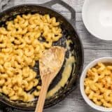 This incredible roux-less mac and cheese is rich, creamy, and only requires seven ingredients. Perfect for last minute weeknight dinners! BudgetBytes.com