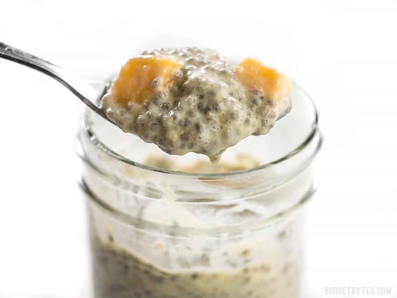 Close up of a spoonful of Mango Coconut Chia Pudding 