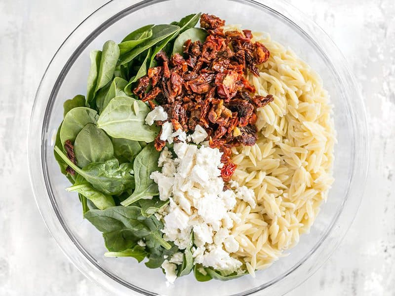 Spinach Orzo Tomatoes Feta in the bowl, not yet combined