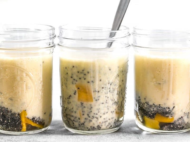 Stir Mango Coconut Chia Pudding in jars