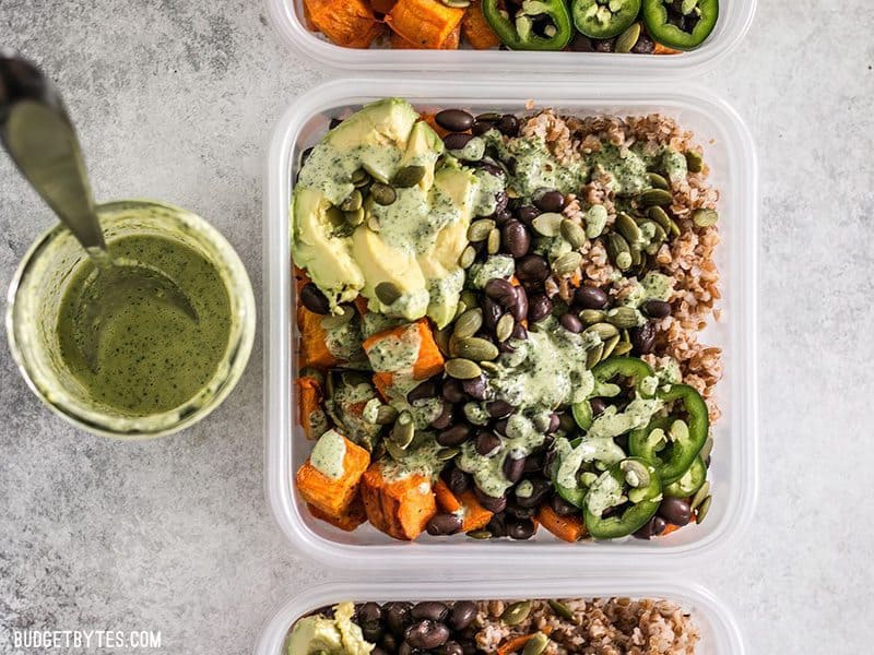 These Sweet Potato Grain Bowls with Green Tahini Sauce are prefect for meal prep and bursting with color, texture, and flavor! BudgetBytes.com