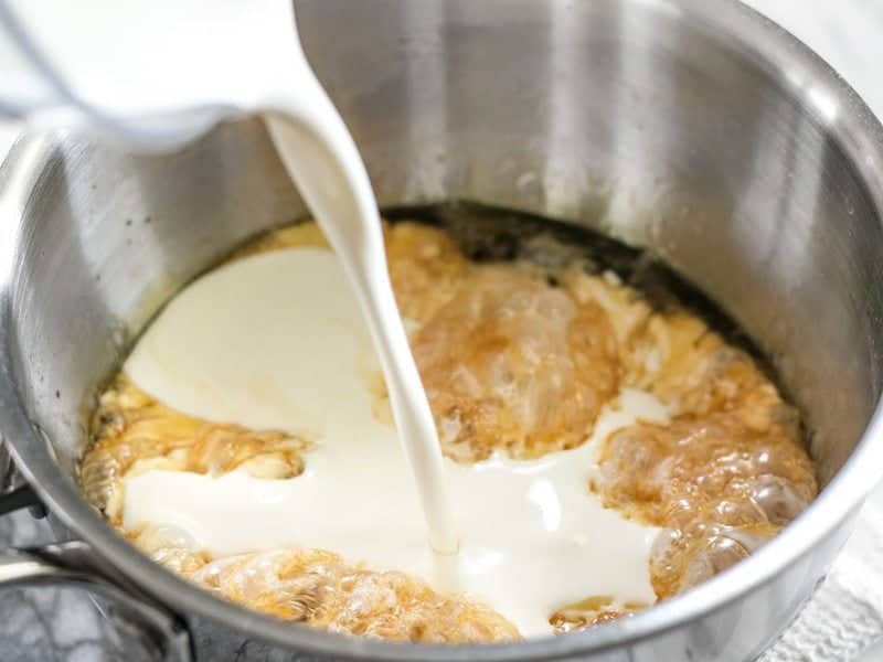 Whisk Heavy Cream into caramelized sugar