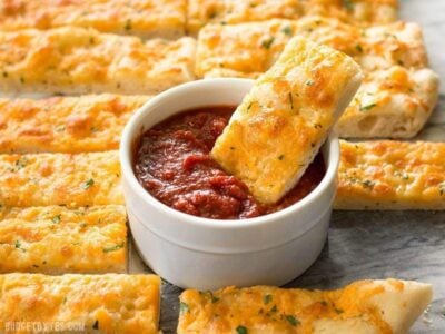 This Homemade Cheesy Garlic Bread is the real deal with homemade dough, fresh garlic, real butter, and your favorite cheese. BudgetBytes.com