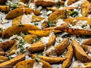 These simple Roasted Potato Wedges are the perfect vehicle for this creamy, garlicky shawarma sauce and crumbled feta. BudgetBytes.com