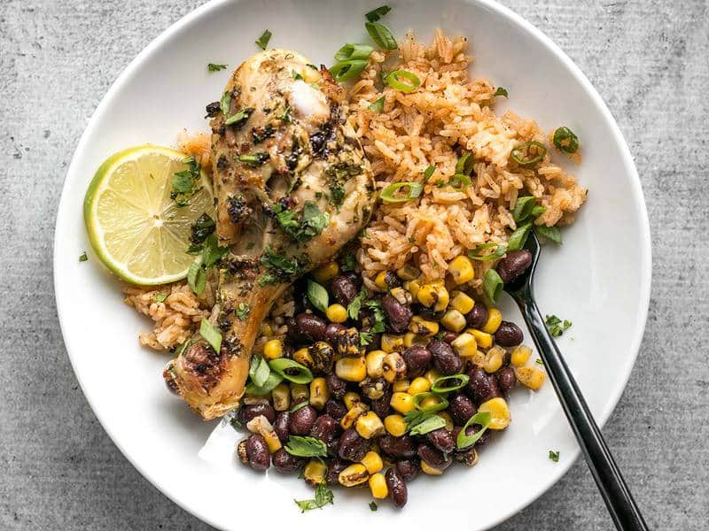 Cilantro Lime Chicken, taco rice, and black beans and corn on a plate