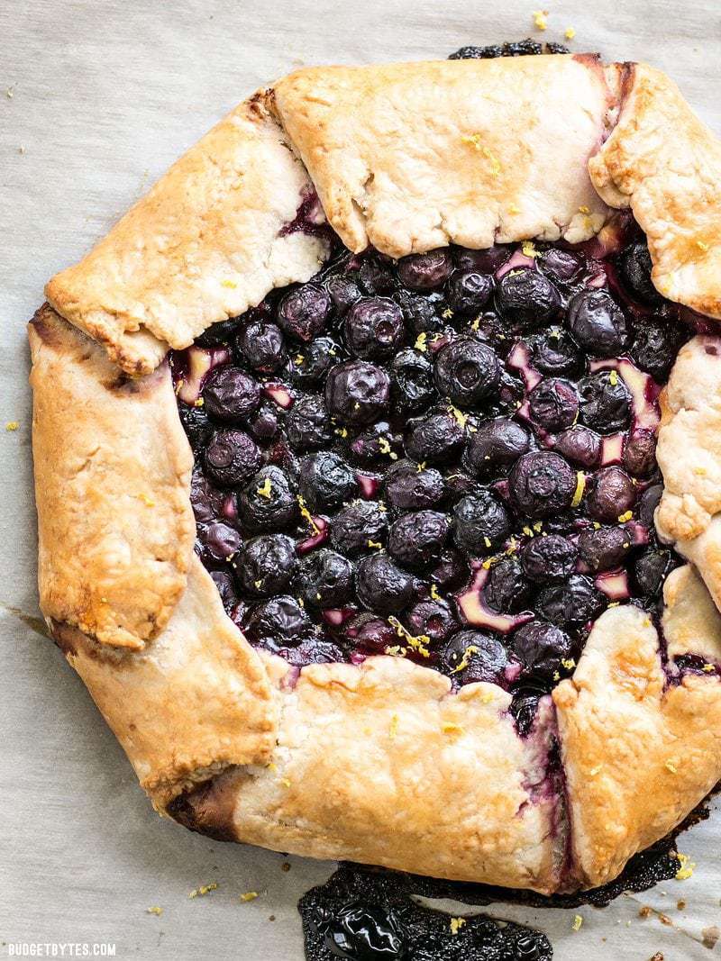 Baked Lemon Blueberry Cream Cheese Galette with fresh lemon zest sprinkled on top