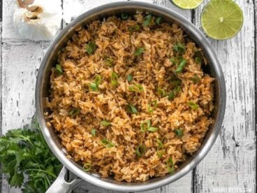 This flavorful Taco Rice is packed full of herbs and spices, but is neutral enough to serve as the base for several different recipes, like bowl meals, burritos, and more! BudgetBytes.com