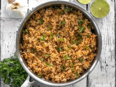 This flavorful Taco Rice is packed full of herbs and spices, but is neutral enough to serve as the base for several different recipes, like bowl meals, burritos, and more! BudgetBytes.com