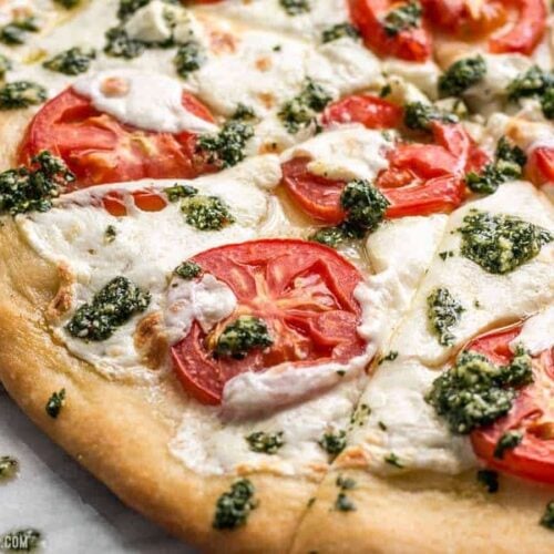 Take your Marghertia pizza up a level with a drizzle of zesty parsley pesto. This white pizza is anything but boring. BudgetBytes.com