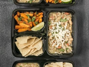 This White Chicken Chili Meal Prep includes a slow cooker chili with Cumin Lime Roasted Sweet Potatoes and tortilla chips for dipping! BudgetBytes.com
