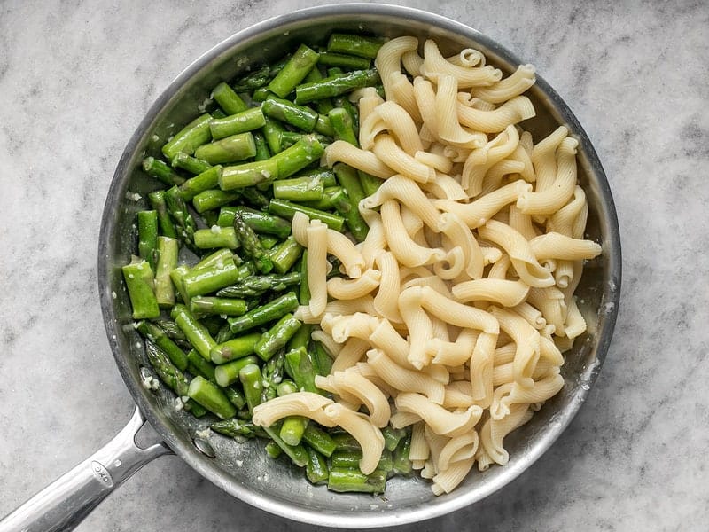 Combine Asparagus and Pasta in skillet