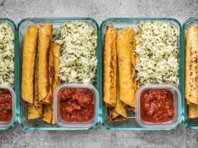 Creamy Black Bean Taquitos pair with tangy Cilantro Lime Rice for a simple and satisfying meal prep. BudgetBytes.com