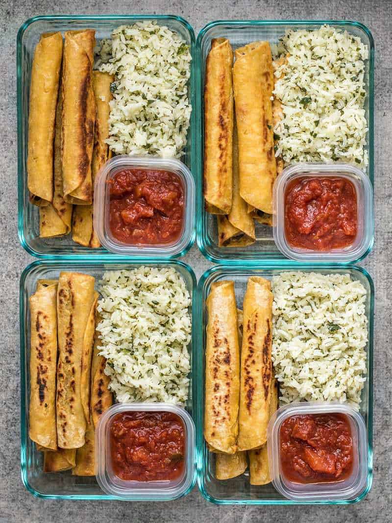 Four Creamy Black Bean Taquito meal prep containers with salsa and cilantro lime rice