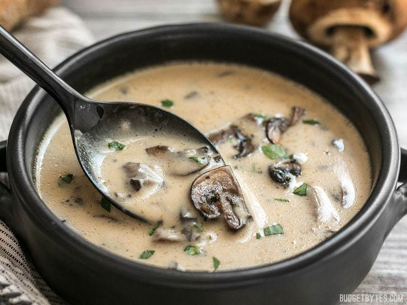 A close up of a spoonful of Creamy Garlic Mushroom Soup.