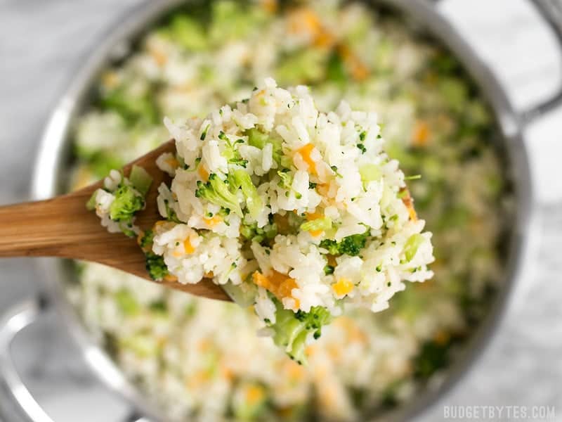 Close up of a spoonful of Easy Cheesy Broccoli Rice