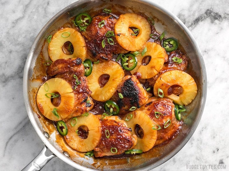 A quick pan sauce drenches tender chicken thighs and thick pineapple slices in this easy Skillet Pineapple BBQ Chicken. BudgetBytes.com