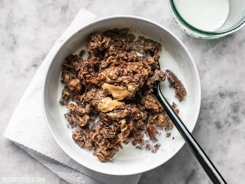 A bowl of Peanut Butter Brownie Baked Oatmeal with milk poured over top