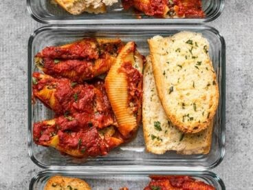 Pesto Stuffed Shells and homemade garlic bread make a classic and comforting lunch that holds up well in the refrigerator. BudgetBytes.com