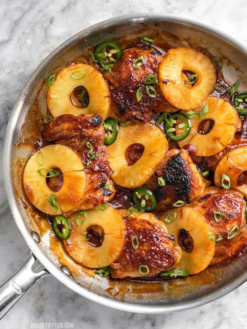 A quick pan sauce drenches tender chicken thighs and thick pineapple slices in this easy Skillet Pineapple BBQ Chicken. BudgetBytes.com