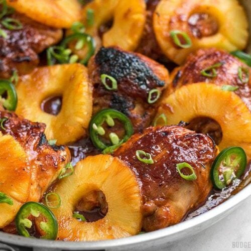 A quick pan sauce drenches tender chicken thighs and thick pineapple slices in this easy Skillet Pineapple BBQ Chicken. BudgetBytes.com